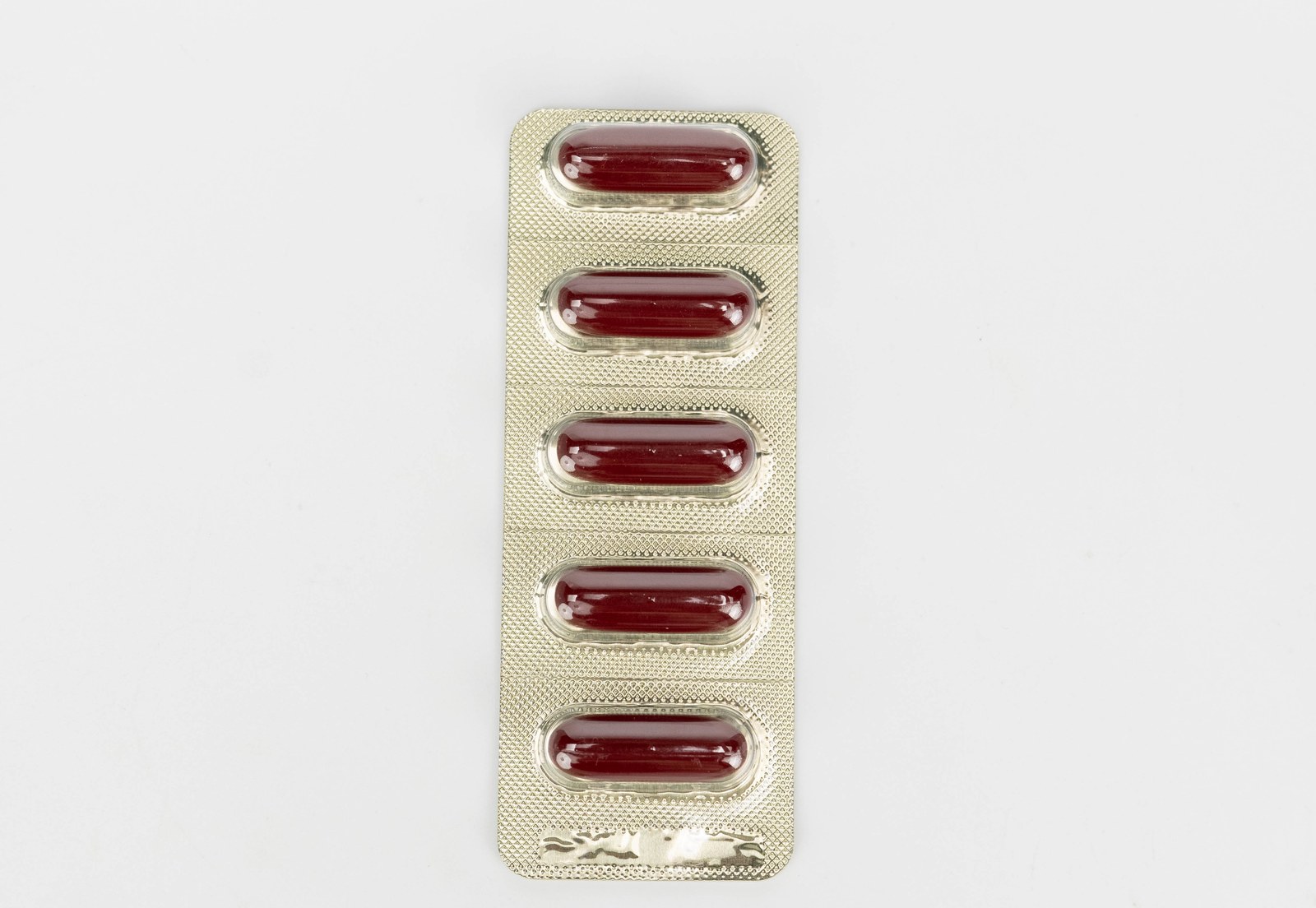 Geomin blister strip of five red softgel capsules